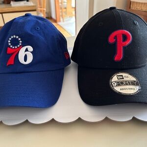 Sixers and Phillies official sports caps.